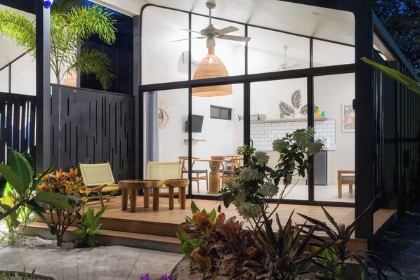 An indoor/outdoor space with a dining area, seating, and plants. - 5 Favela Chic Adults Only 2 Bedroom Bungalow (Tamarindo)