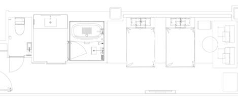 A floor plan of a hotel with a bathroom, a kitchen, and a seating area.