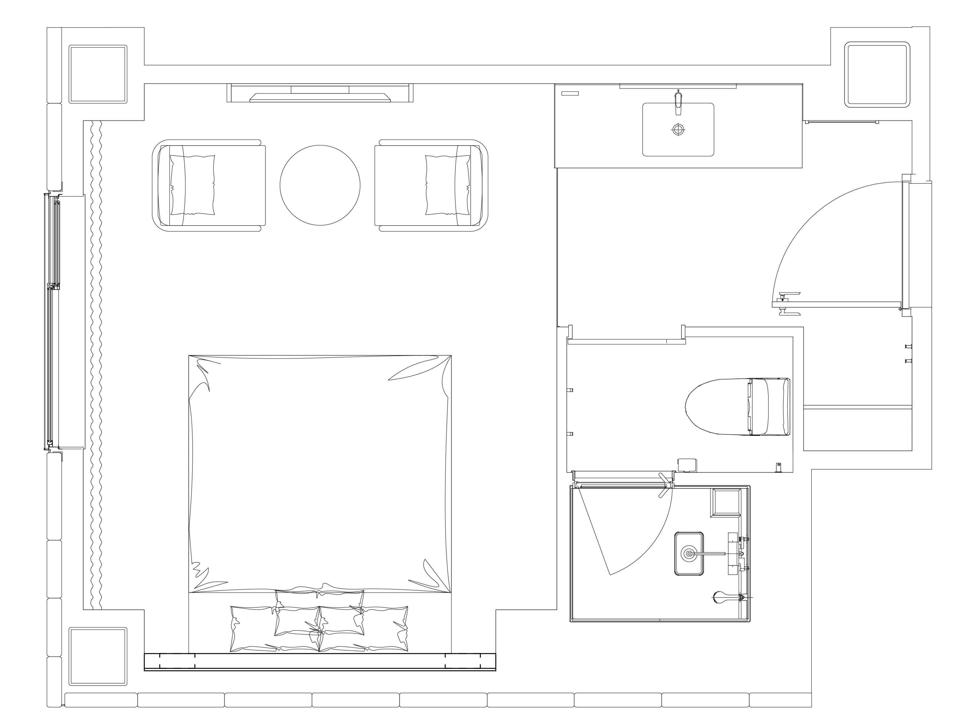 A floor plan of a hotel with a large central room, a separate bathroom, and a small kitchen area.
