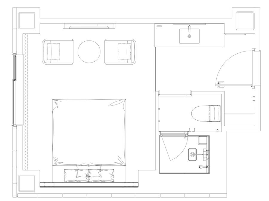 Planta baixa de um hotel com uma ampla sala central, banheiro separado e pequena cozinha.