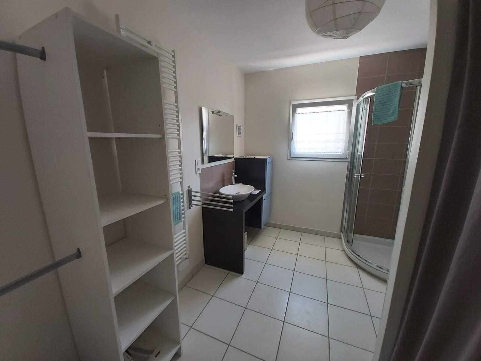 Shower, hair dryer, towels, toilet paper