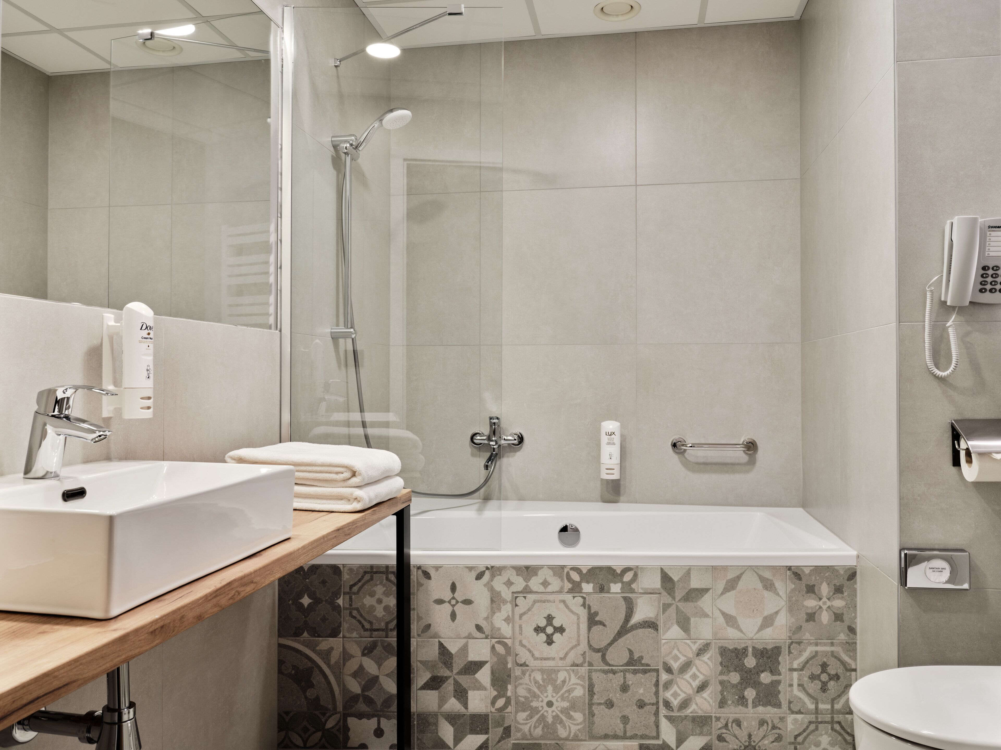 junior studio suite | bathroom | free toiletries, hair dryer, slippers, towels