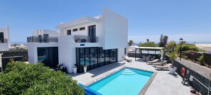 A heated pool, pool loungers