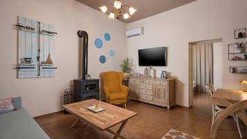 Huis | Woonruimte | Een 42-inch smart-tv met satellietzenders, televisie en Netflix