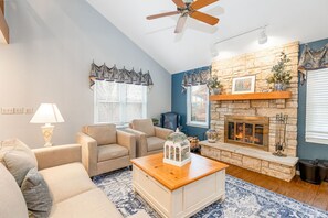Smart TV, fireplace, books, stereo