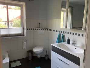 Bathtub, hair dryer, towels, soap