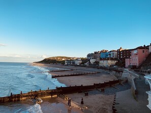 On the beach, sun-loungers