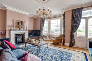 Smart TV, fireplace, video game console, table football