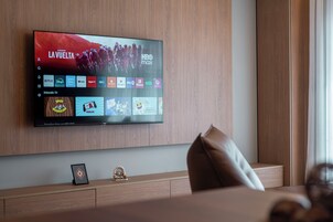 Deluxe Apartment | Living area | 40-inch LCD TV with cable channels, TV