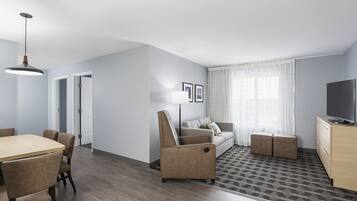 Premium bedding, pillowtop beds, laptop workspace, blackout drapes