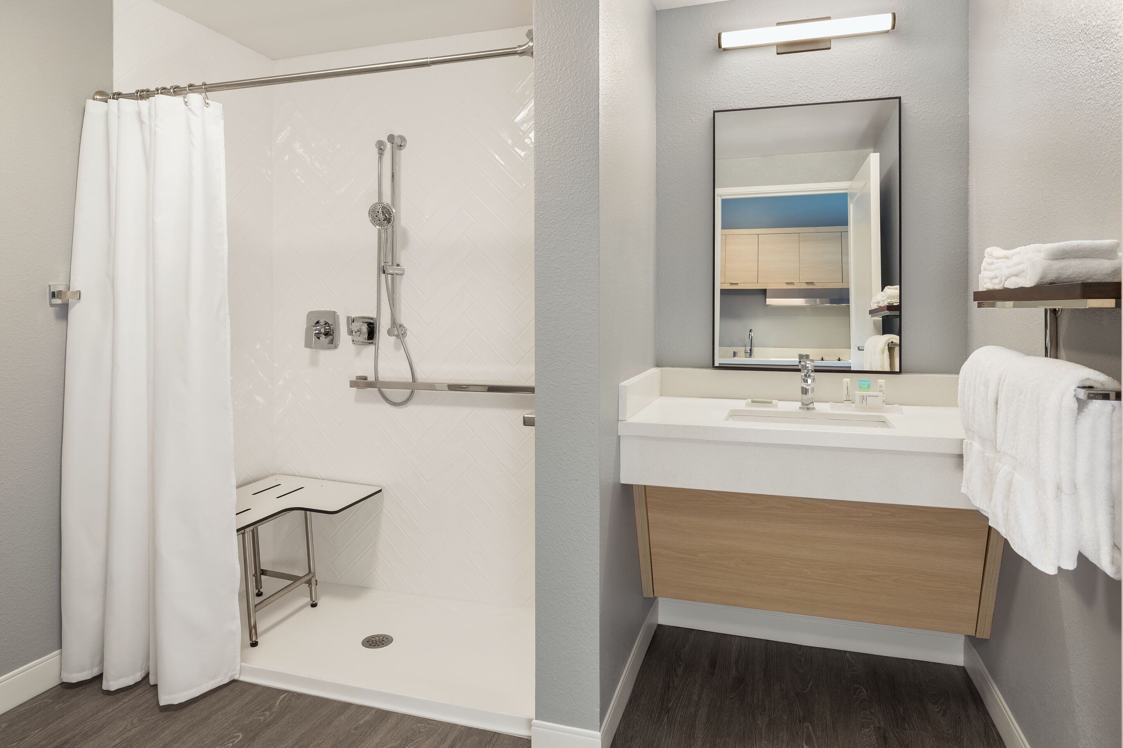 designer toiletries, hair dryer, towels, soap