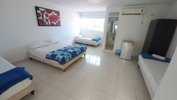 Quarto família | Frigobar, Wi-Fi de cortesia, roupa de cama