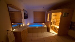 A modern bathroom with a bathtub, a sink, and a shower area. - Abhainn Cottage (Isle of Lewis)