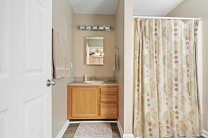 Combined shower/tub, hair dryer, towels, soap