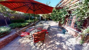 Outdoor dining - This deluxe Spanish-style 4-bedroom home offers the best of Bozeman! (Bozeman)