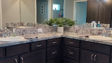 Combined shower/tub, hair dryer, towels, soap