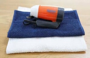 Towels neatly folded on a surface.