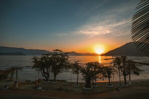 On the beach, black sand, beach towels