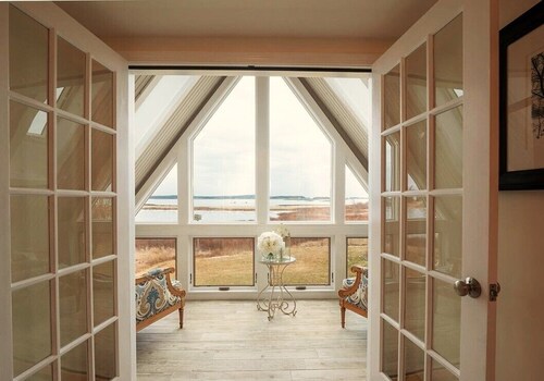 Quintessential waterfront home with over 400 feet of private sandy beach.