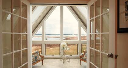 Quintessential waterfront home with over 400 feet of private sandy beach.