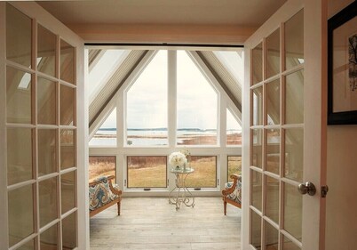 Quintessential waterfront home with over 400 feet of private sandy beach.