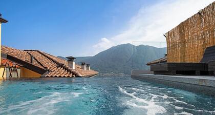 Maison de vacances Colonno Penthouse avec vue sur lac, piscine à débordement et bain à remous