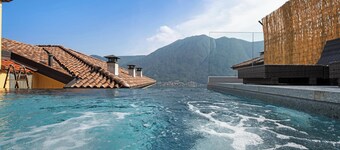 Vacation Home Colonno Penthouse with Lake View, Infinity Pool, Whirlpool & Garden