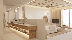 A modern bedroom with a large bed, a vanity with a mirror, a television, and a ceiling fan. - Universal Hotel Laguna (Capdepera)