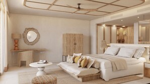 A modern bedroom with a large bed, bedside tables, a mirror, and a ceiling fan. - Universal Hotel Laguna (Capdepera)