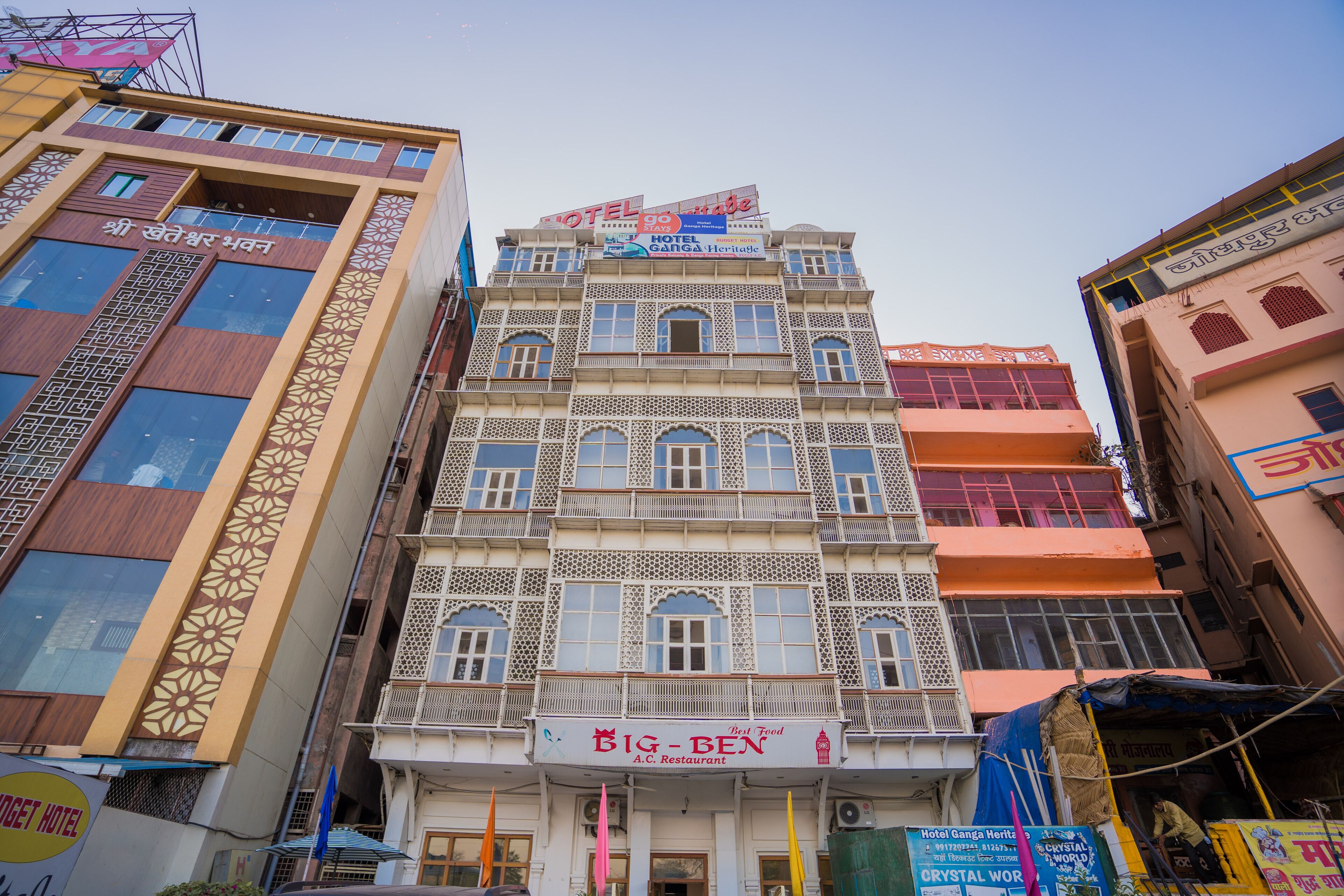 A multi-story building with a sign for 'Big Ben A.C. Restaurant' on the ground floor.