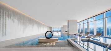 Indoor pool, open 7:00 AM to 10:00 PM, sun loungers, lifeguards on site