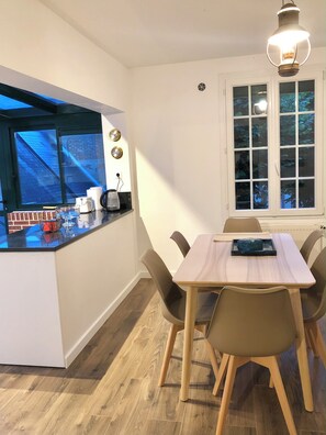 Enjoy casual meals at the kitchen table with a view of the outside.