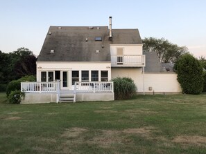 Stroll through the charming front porch and enjoy the serene surroundings of this two-story home.