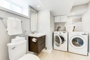 Combined shower/tub, hair dryer, towels, soap - Stylish Modern Suite in the Heart of Chevy Chase! (Washington)