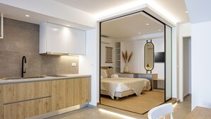 A modern kitchen with a wooden countertop and a built-in sink. - Perfect Hideaway for Families & Unmatched Sunsets (Rethymno)
