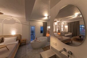 Elite Suite | Bathroom | Hair dryer, slippers, towels, toilet paper