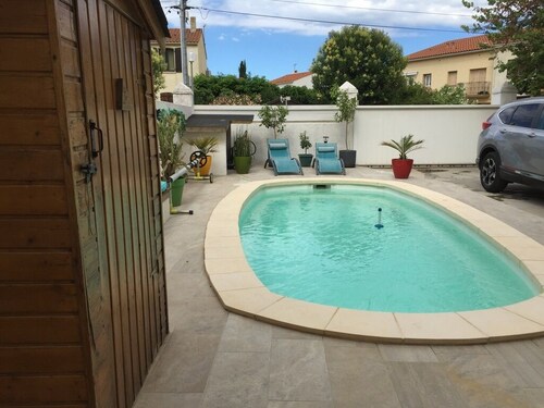 appartement Rez de jardin piscine chauffée, barbecue, plancha