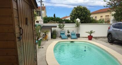 appartement Rez de jardin piscine chauffée, barbecue, plancha