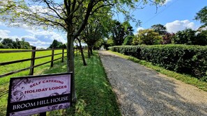 A sign for self-catering holiday lodges at Broom Hill House. - Squirrel, Bespoke holiday lodge in beautiful Suffolk conservation village (Coddenham)