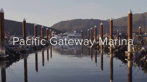 A marina with boats docked, surrounded by calm water and hills in the background. - The Great Escape - Port Renfrew & Bunkhouse (Port Renfrew)