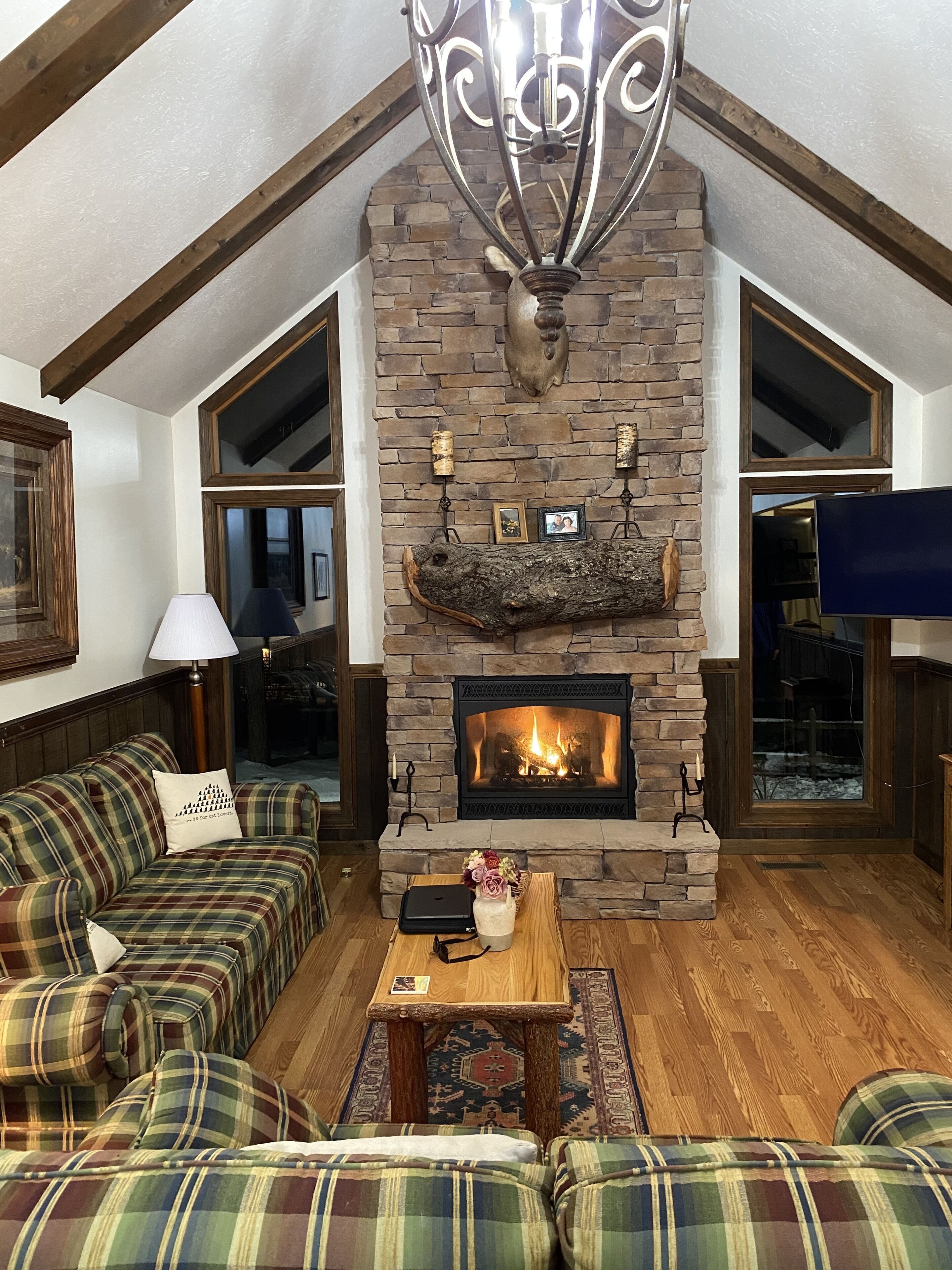 Living room at night with gas fireplace.
