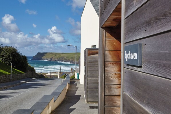 A coastal building with a wooden exterior and a sign reading "Eppaven".