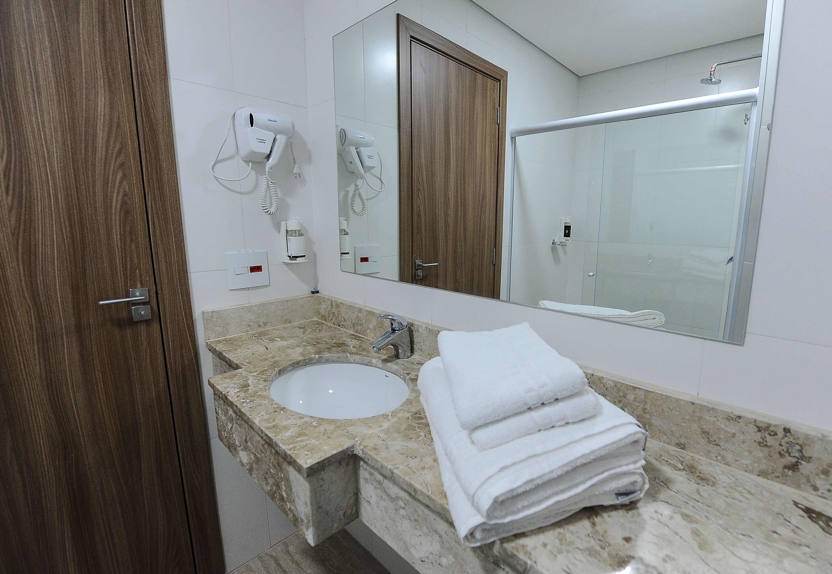executive single room | bathroom | shower, hair dryer, towels, soap