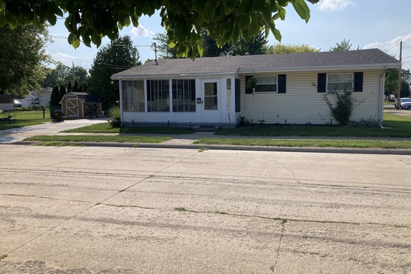 front of 312 Beech St. , showing front porch with side patio/driveway and yard