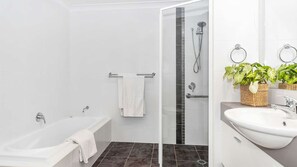 Bathtub, hair dryer, towels