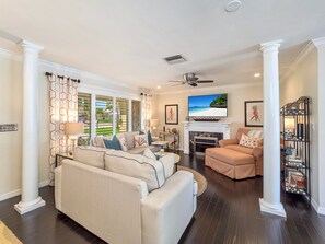 Smart TV, fireplace, books, stereo