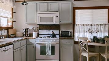 Coffee/tea maker, fridge, microwave, oven
