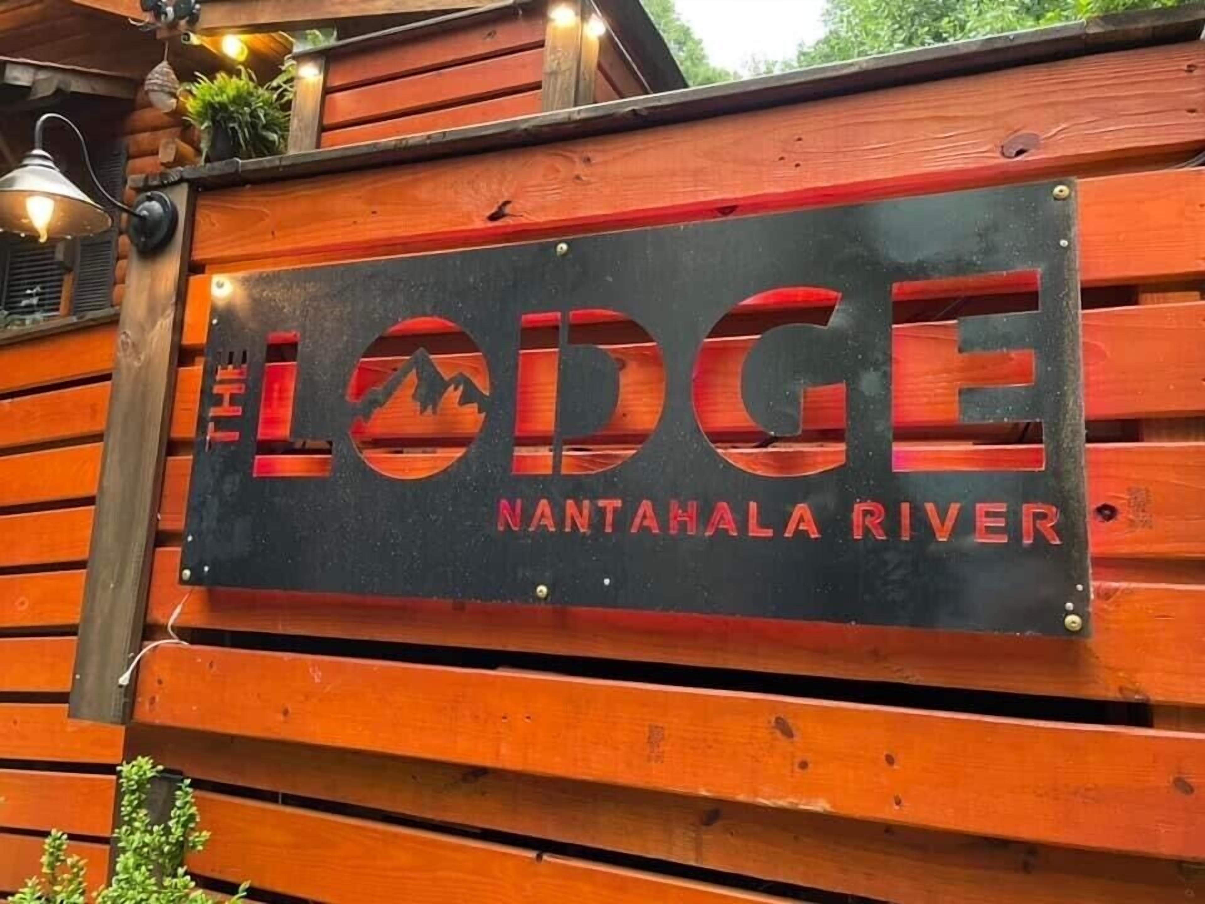 A sign for The Lodge Nantanala River.