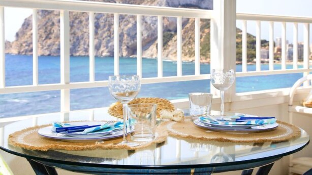 A table set for two with a view of the sea and mountains. - Orellana by Interhome (Calpe/Calp)
