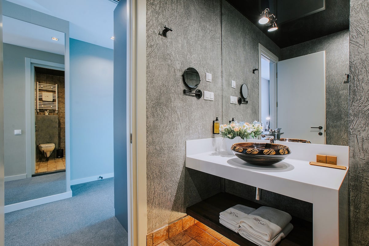 shower, slippers, bidet, towels